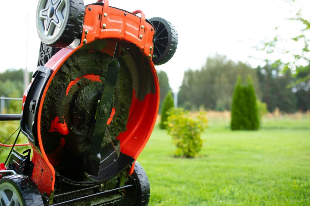 self-propelled lawn mower, dirty blades after work