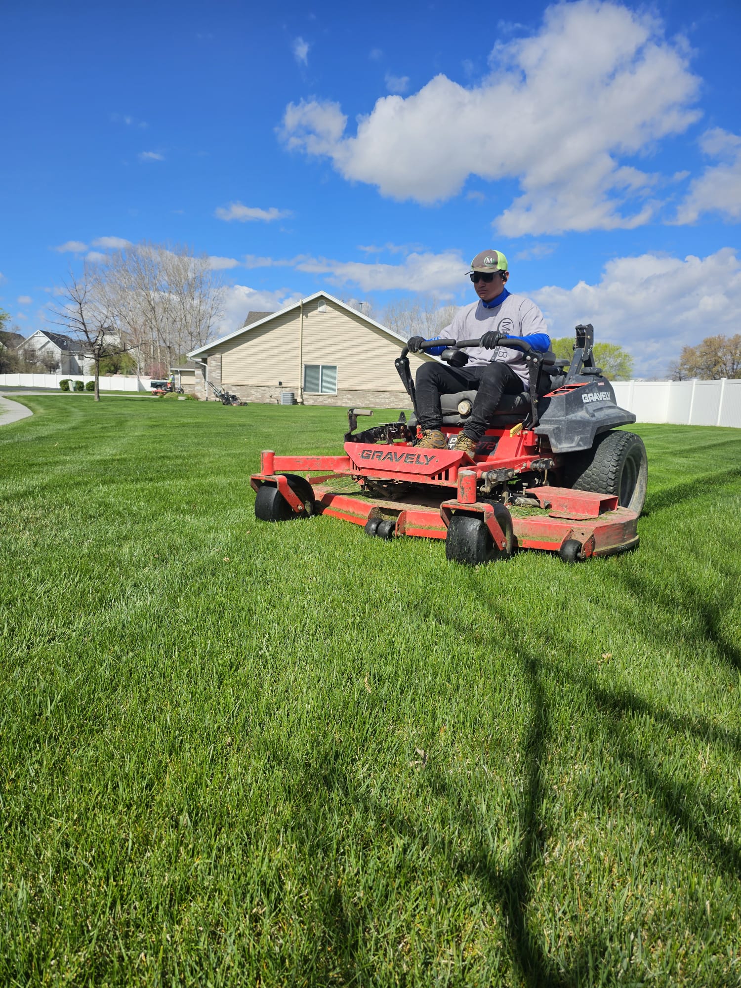 Saratoga Mowing technician doing final fall lawn mowing